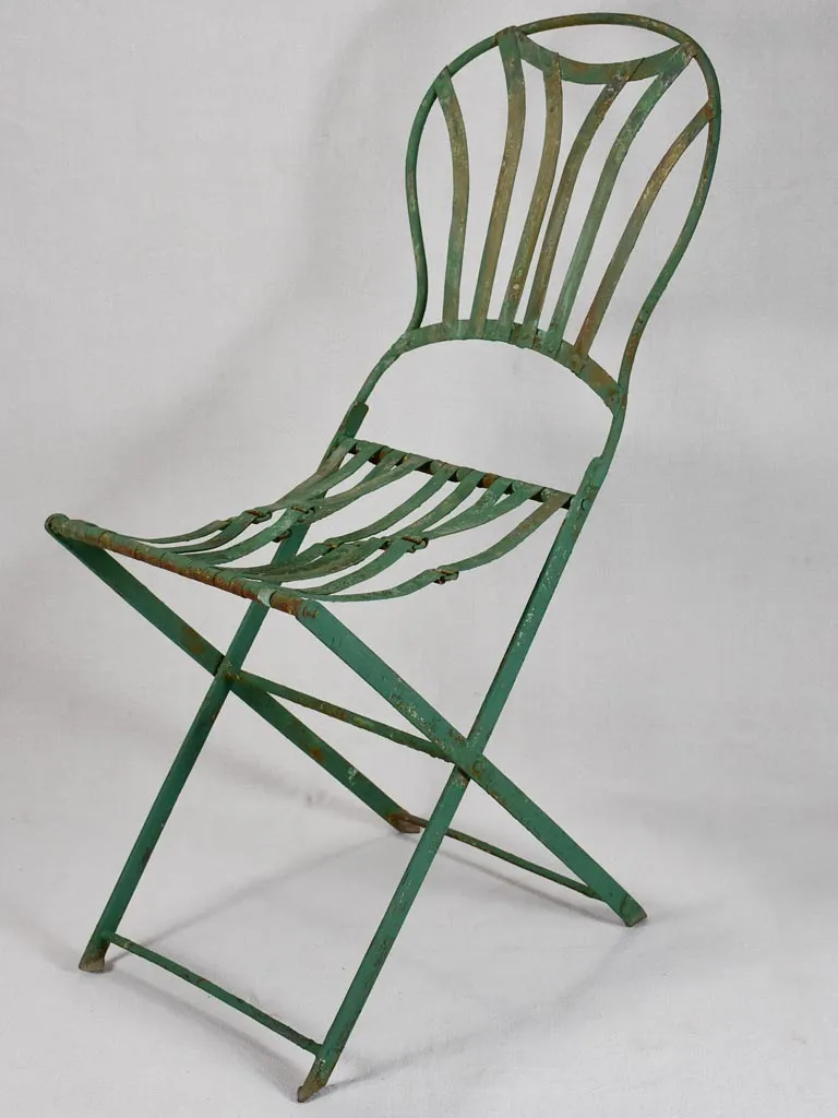 Pair of folding chairs from the military with green patina