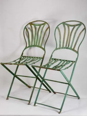 Pair of folding chairs from the military with green patina