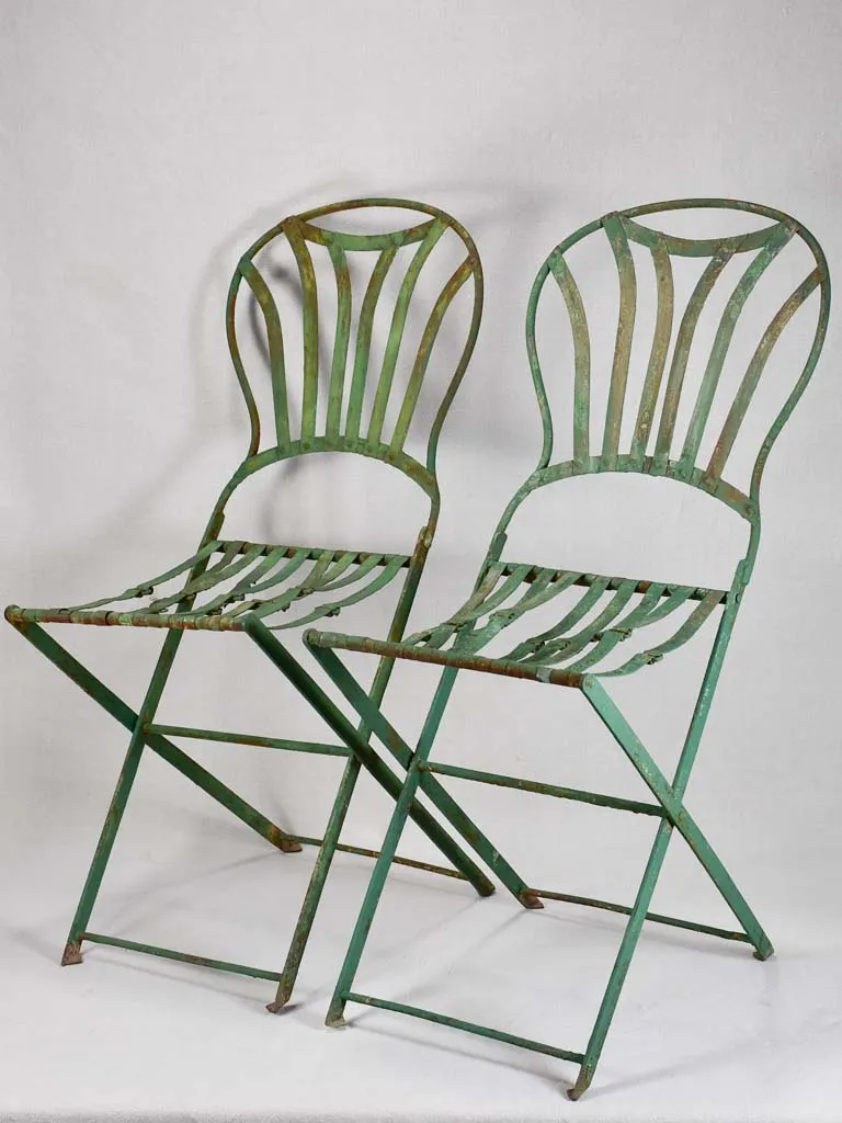 Pair of folding chairs from the military with green patina
